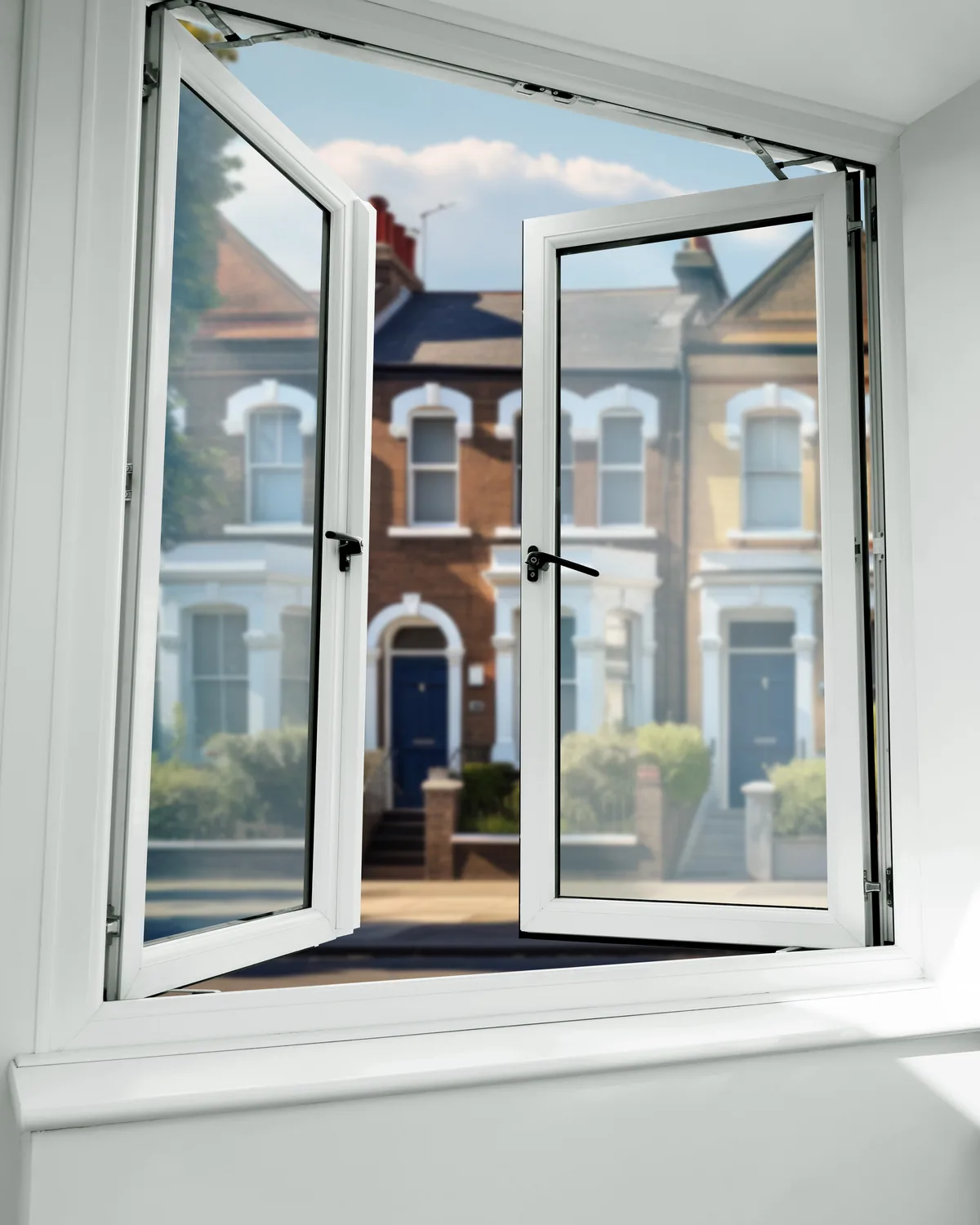 White uPVC French casement window with both sashes open outward and no central mullion, seen from inside
